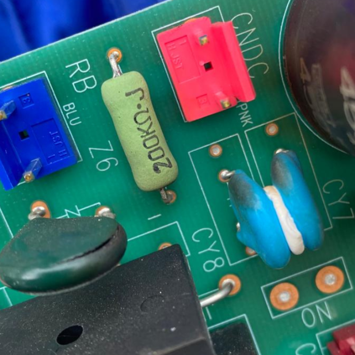 Close-up of damaged resistor on control board in Mitsubishi condensing unit