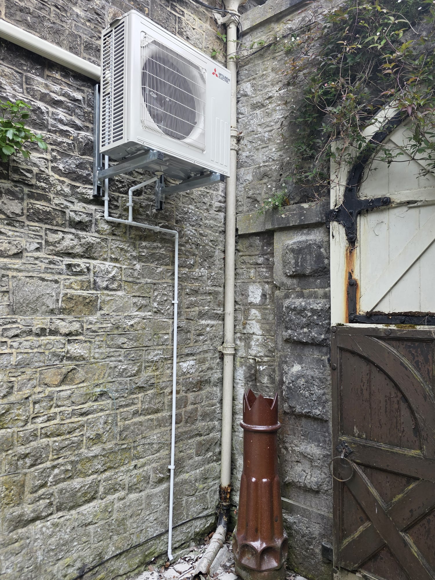 Outdoor unit on wall brackets